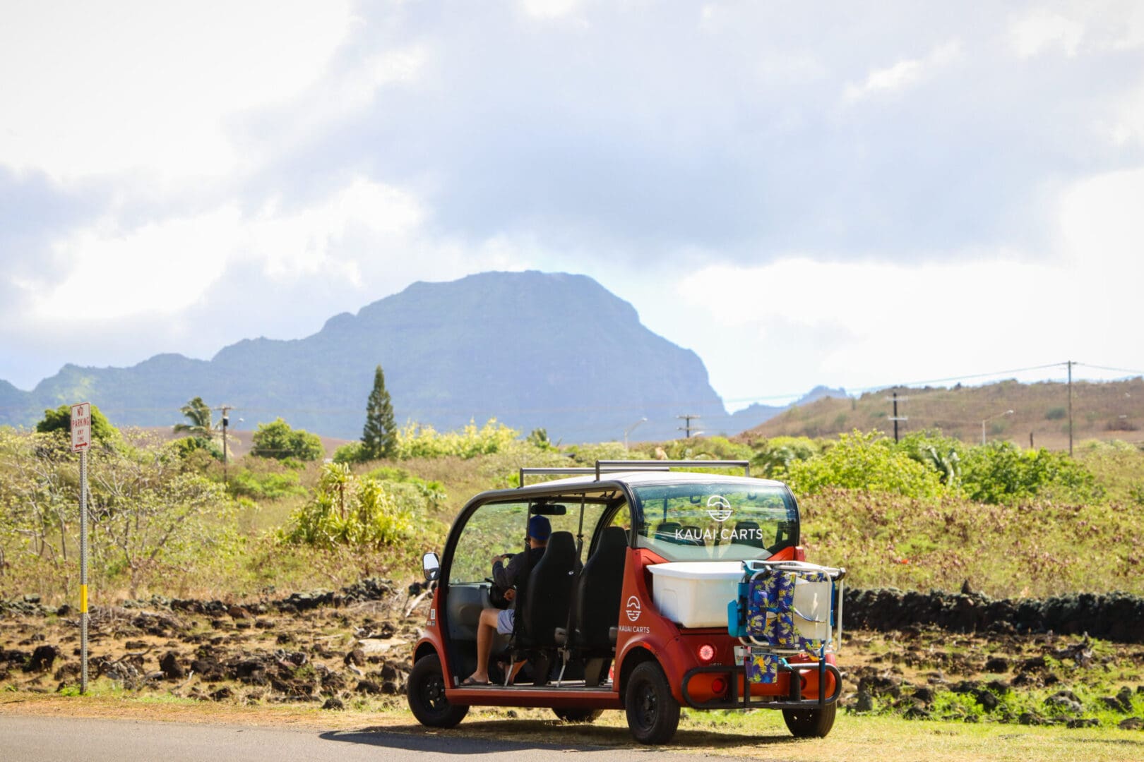 A red and white car driving down the road